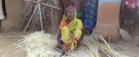 Kajri Masomot help her family in making bamboo craft