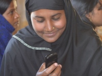 Women using mobile to get information about maternal health