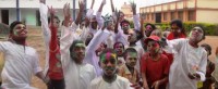 Homeless children playing Holi